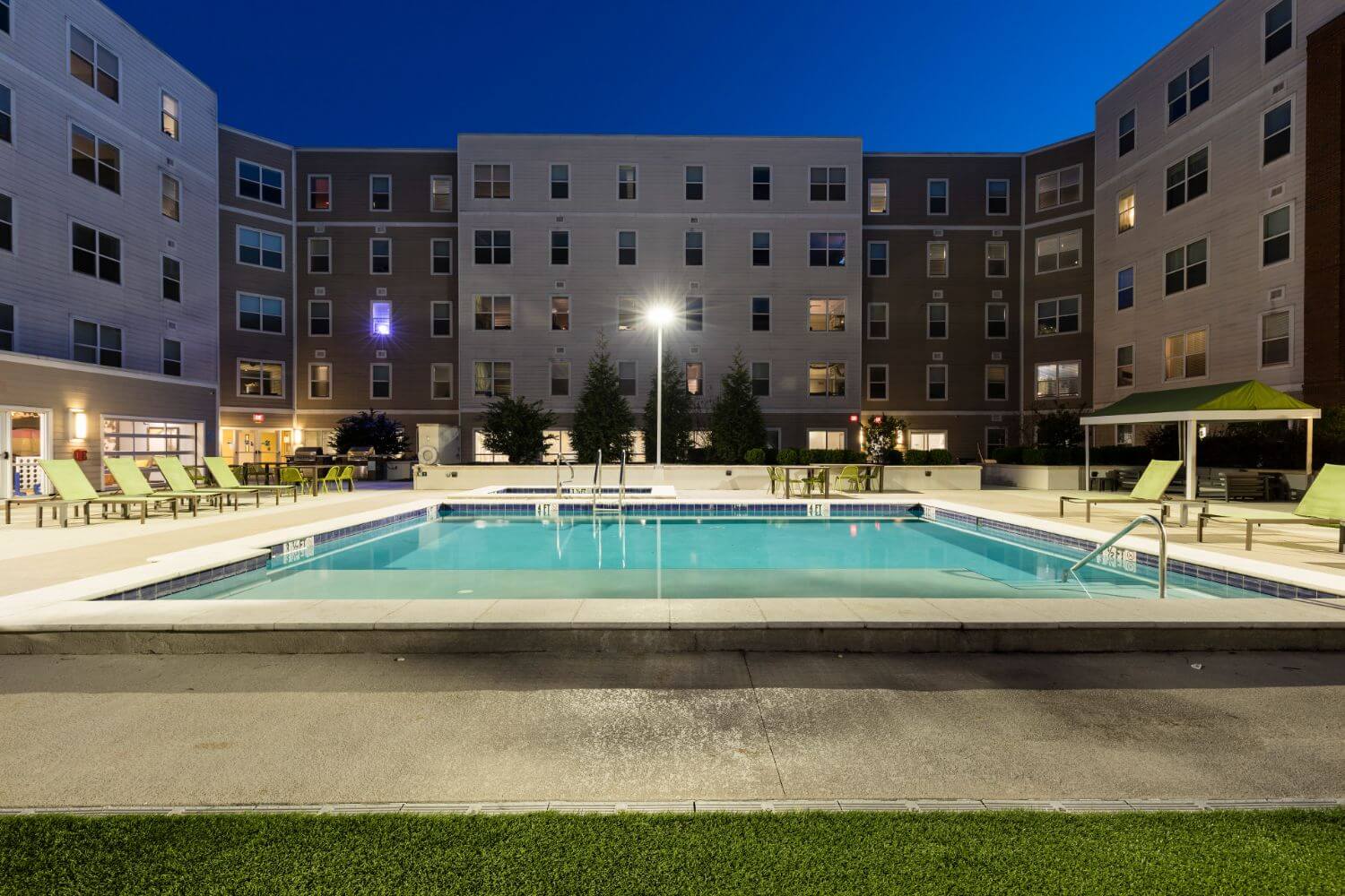 twilight view of the pool at west & wright apartments